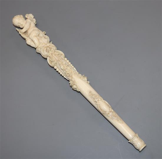 A 19th century Dieppe carved ivory parasol handle length 27.5cm